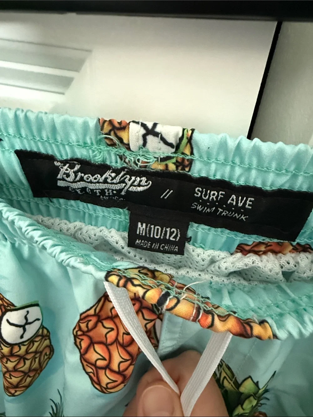 Brooklyn Cloth Boys Pineapple Print Swim Trunks in Aqua and Orange